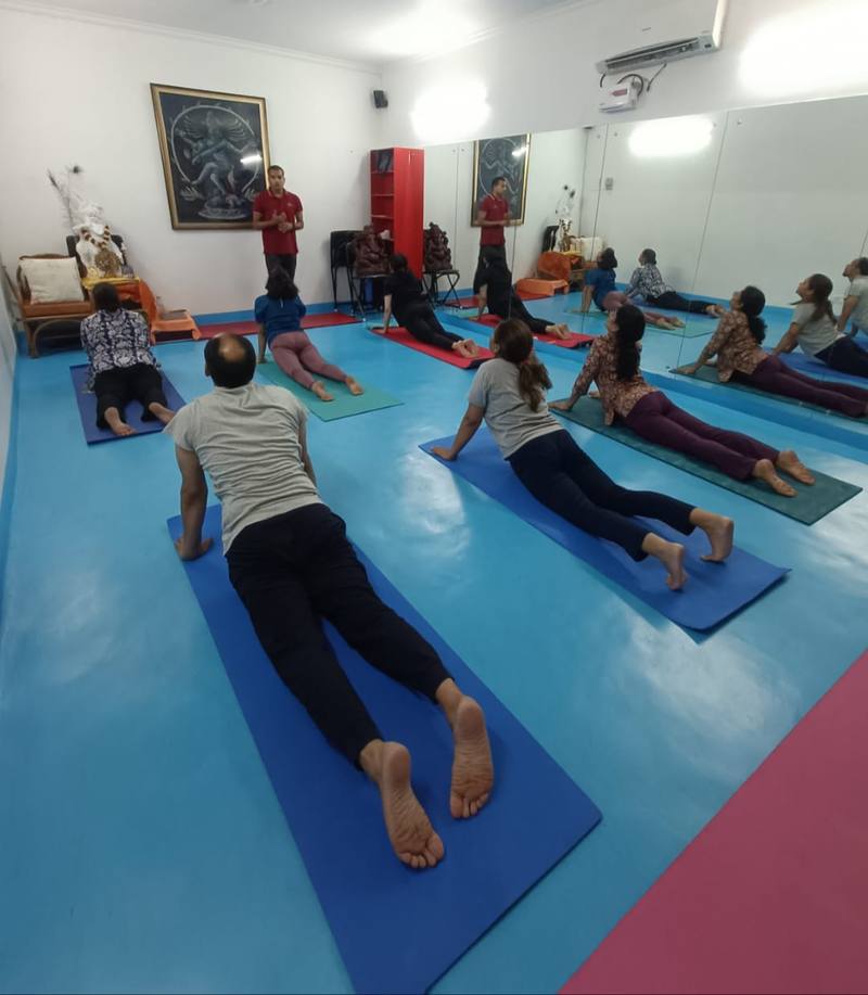 Dr. Vijay Ojha leading yoga class