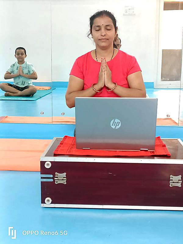 Online yoga class via laptop